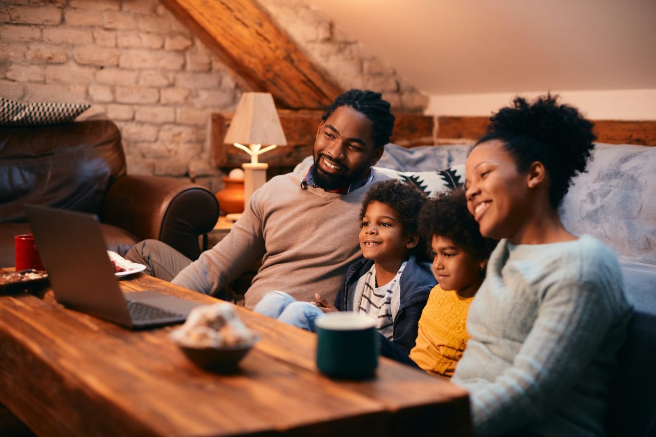 happy-african-american-family-enjoying-while-watching-movie-on-laptop-at-home-1-1.jpg